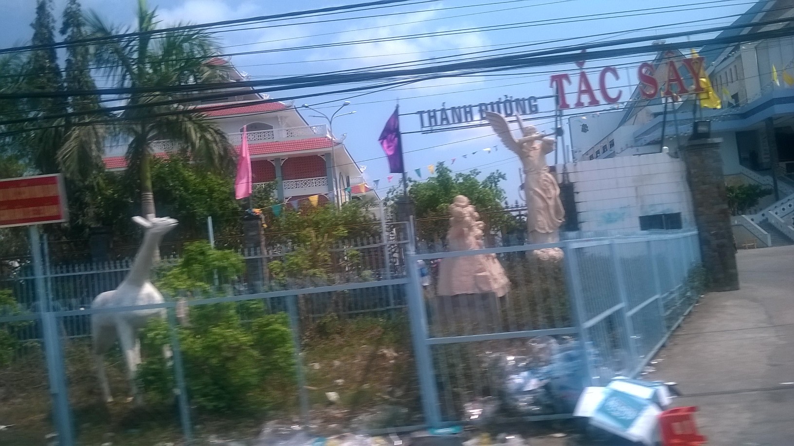 Bac Lieu tac say church passing statues mar16